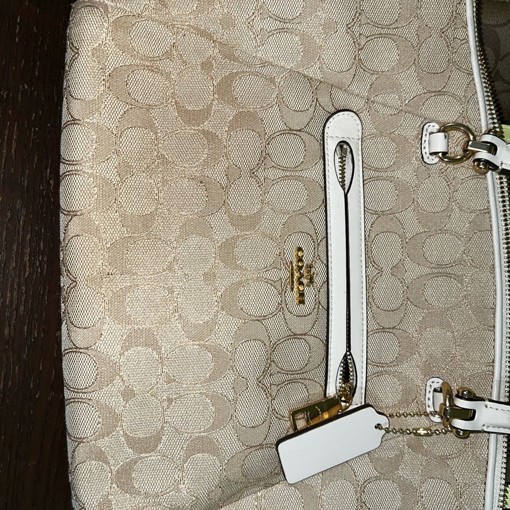 Mildly used Coach pocketbook.